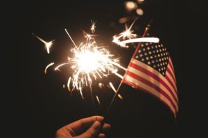 A sparkler and Flag for South Haven 4th of July