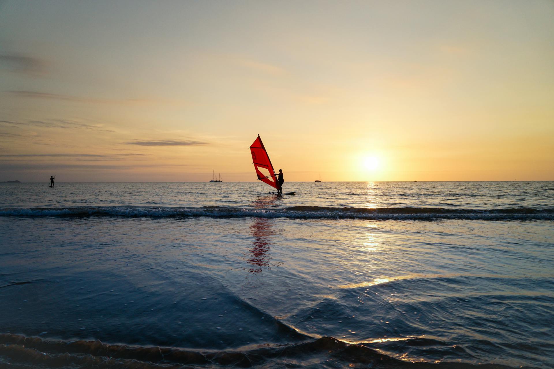 A wind surfer during sunset